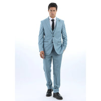 Man wearing a light blue suit with a white shirt and black tie on a white background